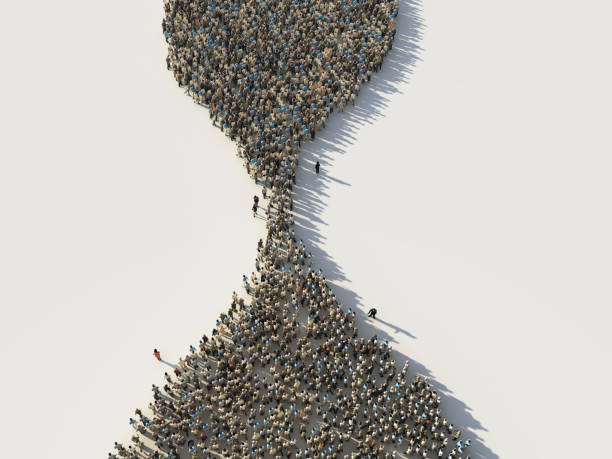 crowd of people in the shape of a hourglass crowd of people in the shape of a hourglass queuing stock pictures, royalty-free photos & images