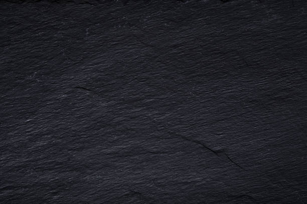 istock Dark gray black slate background or texture of natural stone. 1085218962