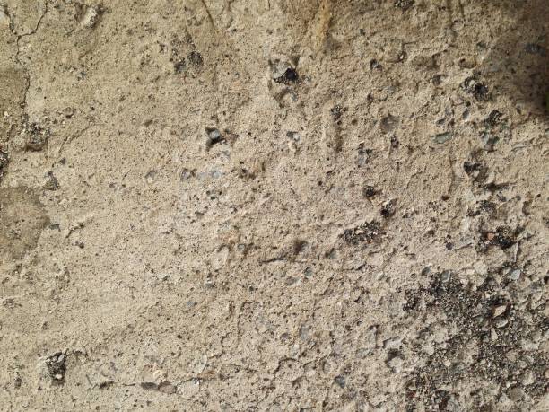 istock cement floor of rough stones, texture 1085219068