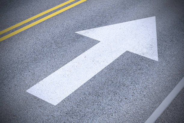 New arrow into the future. Arrow painted on asphalt. Road markings