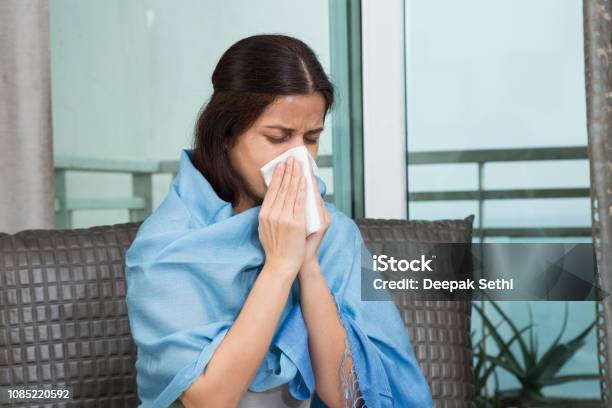 Sick Woman Blowing Her Nose Stock Image Stock Photo - Download Image Now - India, Cold And Flu, Obscured Face