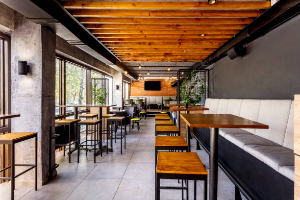Interior of a modern industrial design pub Interior of a modern industrial design pub with a rustic twist cafeteria photos stock pictures, royalty-free photos & images