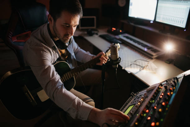 istock Music producer working with analog equalizer at studio 1085226260