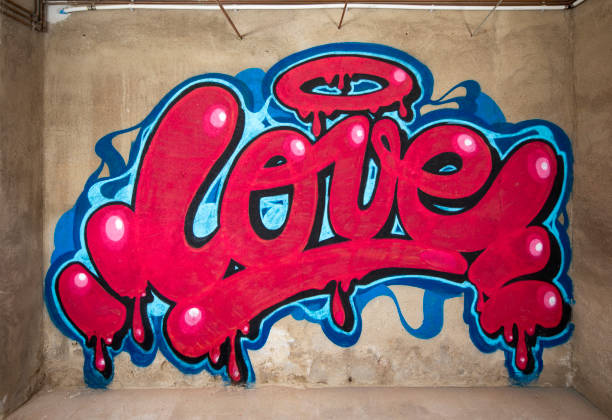 граффити слово любовь на стене - picture of the word love стоковые фото и изображения