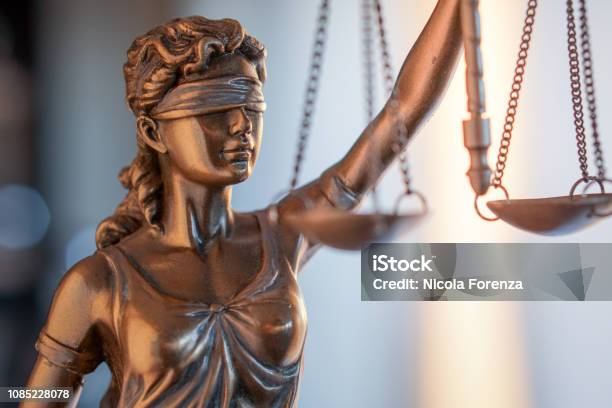 Statue Of Justice With Scales In Lawyer Office Legal Law Advice And Justice Concept Stock Photo - Download Image Now