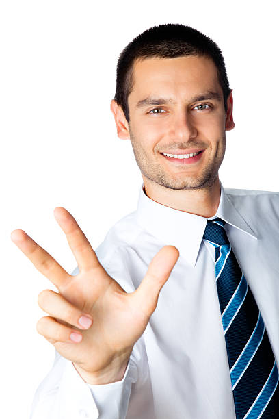 Happy businessman showing three fingers, isolated on white stock photo