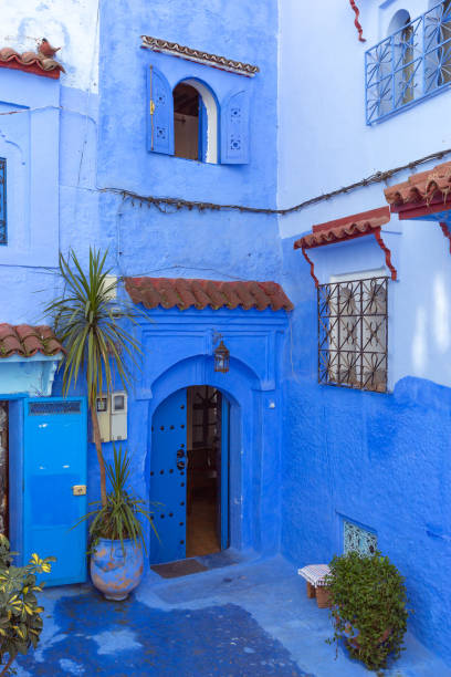istock Traditional house on blue street Morocco 1085234614