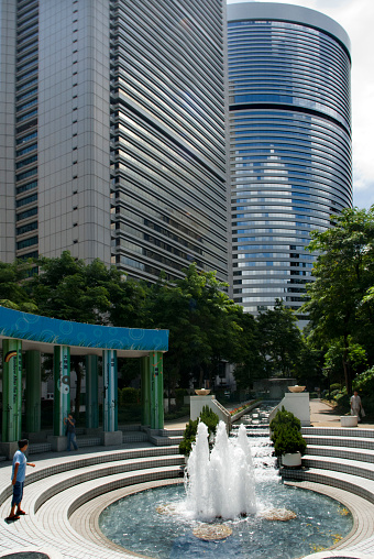 Fountain at Hong Kong Park, Hong Kong, China. The Hong Kong Park is a public park next to Cotton Tree Drive in Central, Hong Kong. It covers an area of 80,000 m²