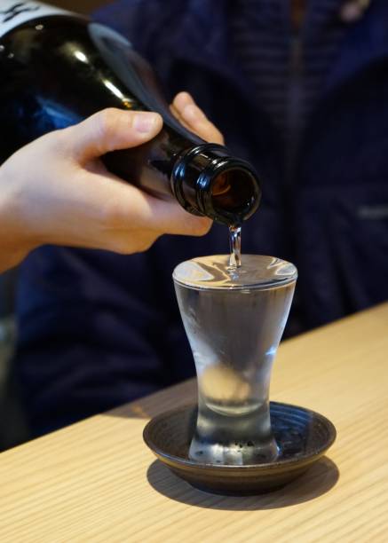 istock Japanese sake pouring 1085239136