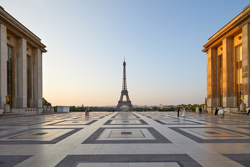 PARIS, FRANCE - JULY 7, 2018: Eiffel tower and Trocadero with some people in a clear summer morning in Paris, France