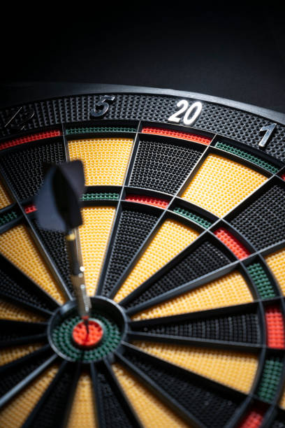 istock One dart in bullseye of dartboard 1085244254
