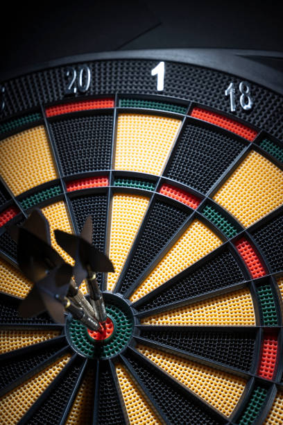 istock Three darts in bullseye of dartboard 1085245368