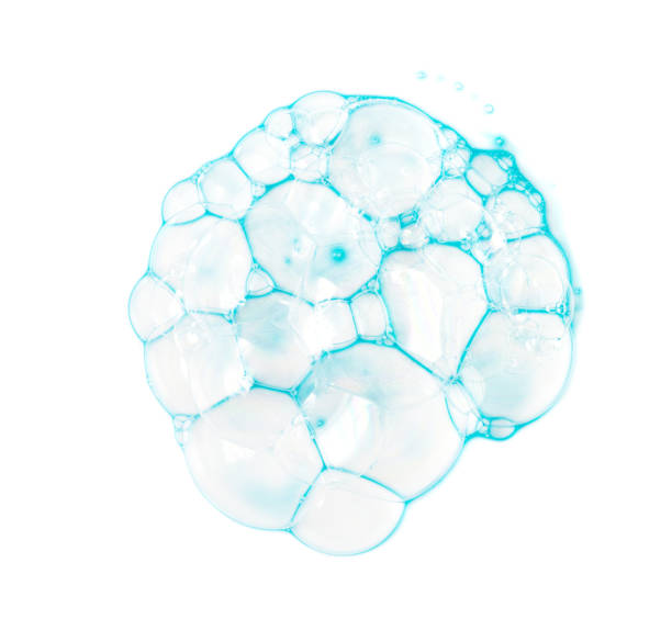 istock Soap bubbles on a white background from blue shower gel, top view. 1085245808