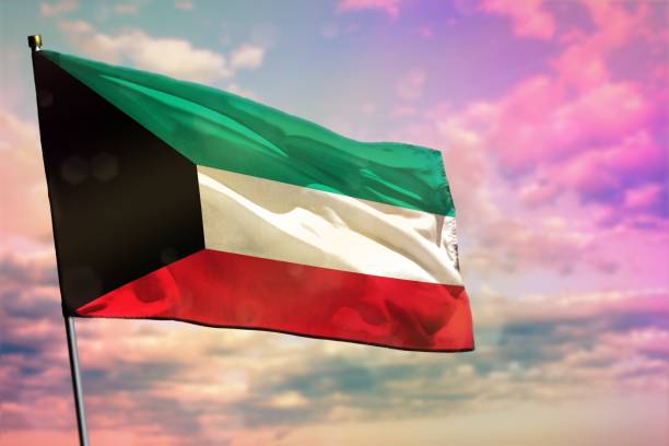 istock Fluttering Kuwait flag on colorful cloudy sky background. Prosperity concept. 1085246246