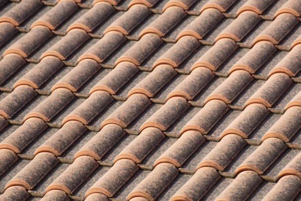 istock orange roof and blue sky background close up 1085246410
