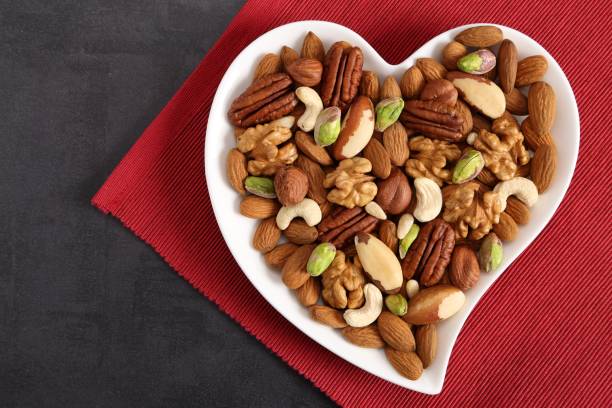 istock Nuts on a plate in the shape of a heart. 1085251354