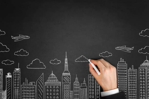 istock Businessman Drawing a Cityscape 1085253914