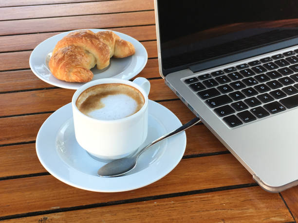 istock Business breakfast with coffee and croissant 1085257132