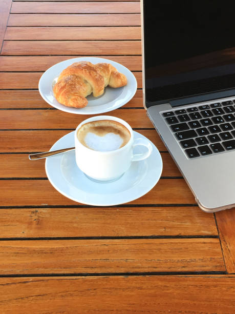 istock Business breakfast with coffee and croissant 1085257146