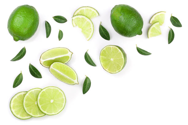 istock sliced lime vith leaves isolated on white background with copy space for your text. Top view. Flat lay pattern 1085257568