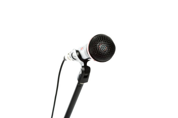 istock close up view of electric microphone isolated on white 1085260020