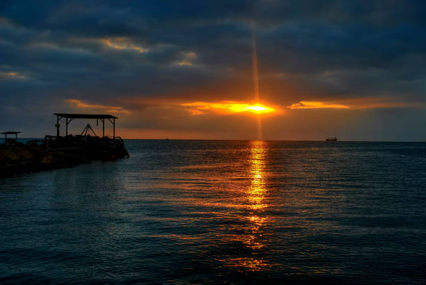 Clear evening sunset on the bay on the Black Sea. blurred picture of a small area on the banks of field