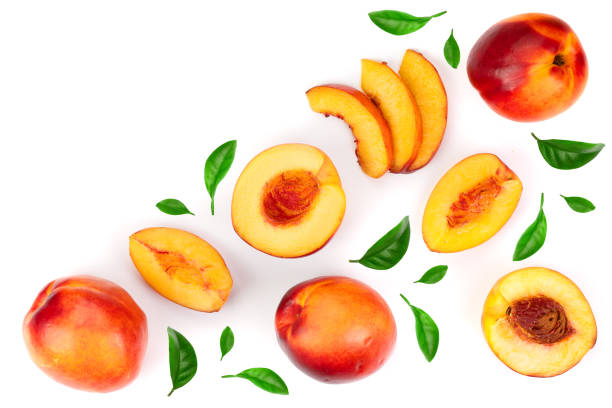 istock ripe nectarine with leaves isolated on white background with copy space for your text. Top view. Flat lay pattern 1085268528