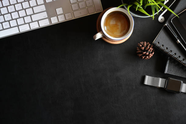 istock Office leather business desk table with office gadget and copy space. 1085270416