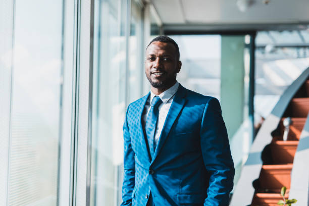 istock Businessman looking at camera in the board room 1085271304