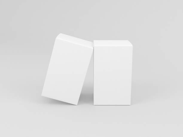 istock Two White textured boxes packaging mockup for fragrance or perfume isolated in gray studio 1085276008
