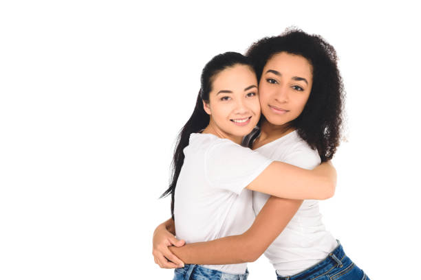 istock multicultural friends hugging and looking at camera isolated on white 1085279056