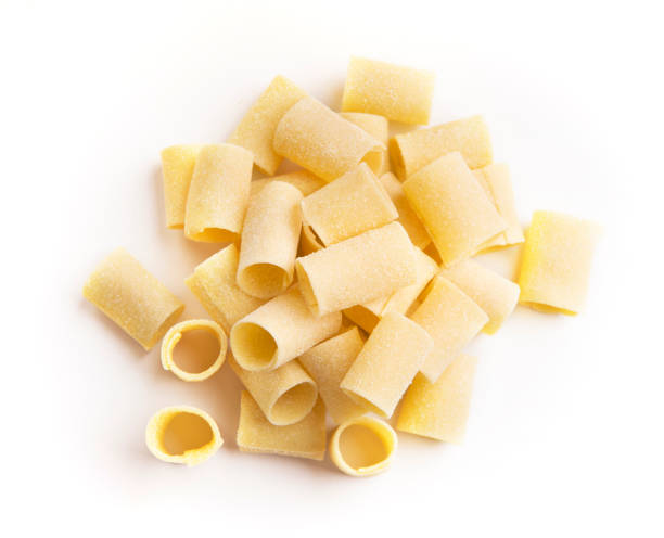 istock Pile of raw paccheri on white background 1085279414