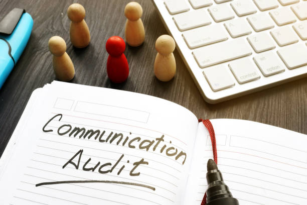 istock Communication audit written in a note and wooden figures. 1085283452