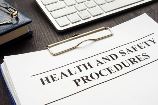 istock Clipboard with health and safety procedures on the table. 1085283576