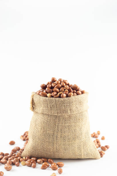istock sack of beans on white background. 1085284928