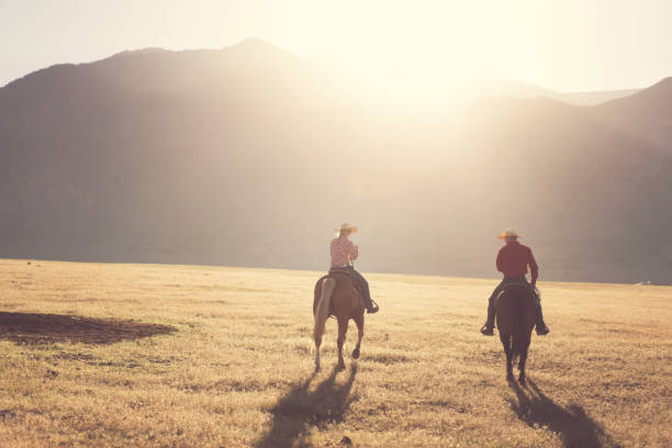 istock Cowboys Horseback Riding at sunrise 1085291286