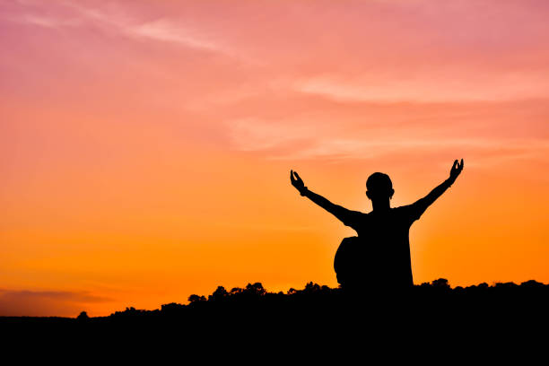 istock Silhouette Of Man With Backpack Standing Against Sky During Sunset 1085292660