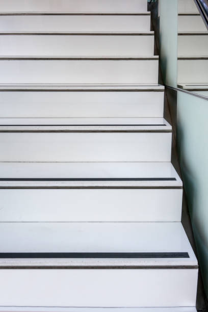 istock Abstract modern white stairs with non-slip line pattern  - stairway composition 1085293574