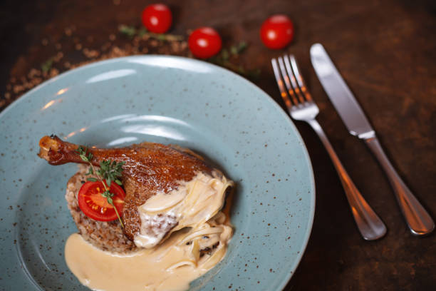 istock duck leg with buckwheat in cream sauce 1085294058