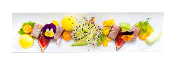 Tasty  fried tuna with mango and avocado, served with fig and flower