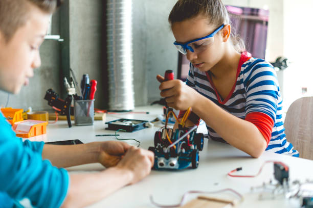 istock Brother and sister working on school project together 1085309712