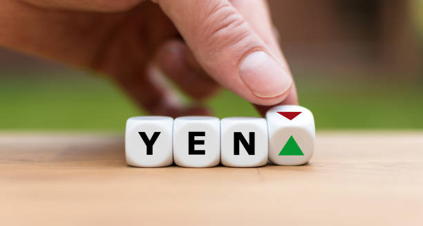 istock Hand is turning a dice and changes the direction of an arrow symbolizing that the value of the Yen is going up (or vice versa) 1085310838