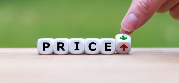 Hand is turning a dice and changes the direction of an arrow symbolizing that the price is going down (or vice versa) Hand is turning a dice and changes the direction of an arrow symbolizing that the price is going down (or vice versa) inexpensive stock pictures, royalty-free photos & images