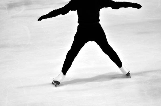 istock Girl with figure skate on interior  ice rink 1085317608