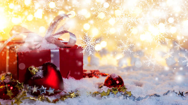 istock Red gift box on snow with bokeh background for christmas and new year 1085317982