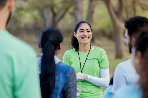 istock Confident volunteer coordinator instructs volunteers 1085318098