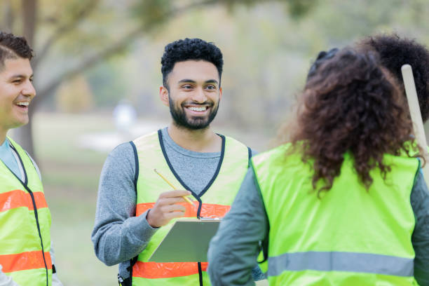 istock Neighbors work together to cleanup community 1085318108