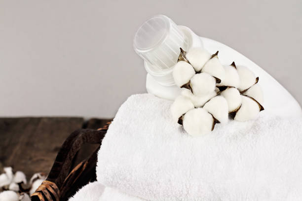 istock Fresh Laundered Towels Soap and Cotton Flowers 1085325186