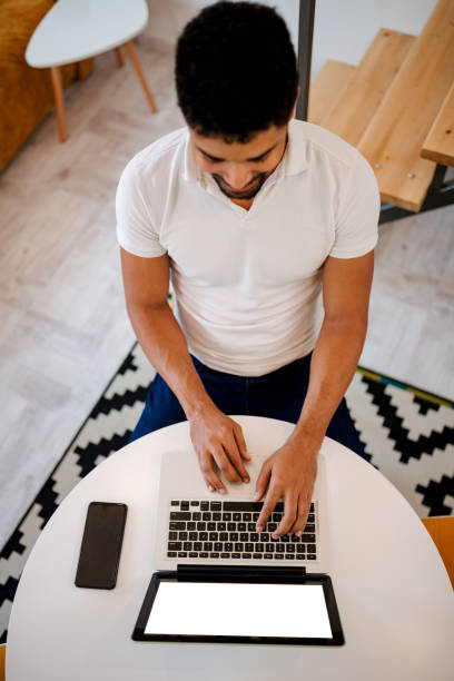 istock Working on laptop at home. Top view. 1085333638