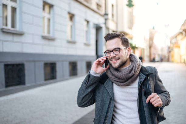istock Walking in the city and talking on smart phone. 1085334098